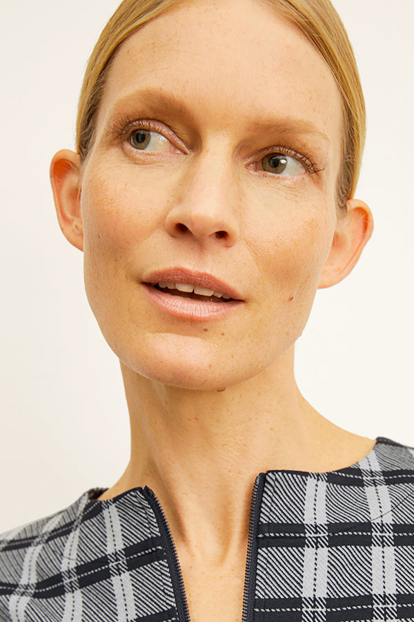 front image of a woman wearing the tully top in checkmate | Exclude