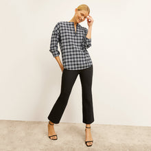 front image of a woman wearing the tully top in checkmate
