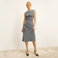 front image of a woman wearing the jeannine dress in checkmate | Lead