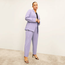 front image of a woman wearing the colby pants in light orchid
