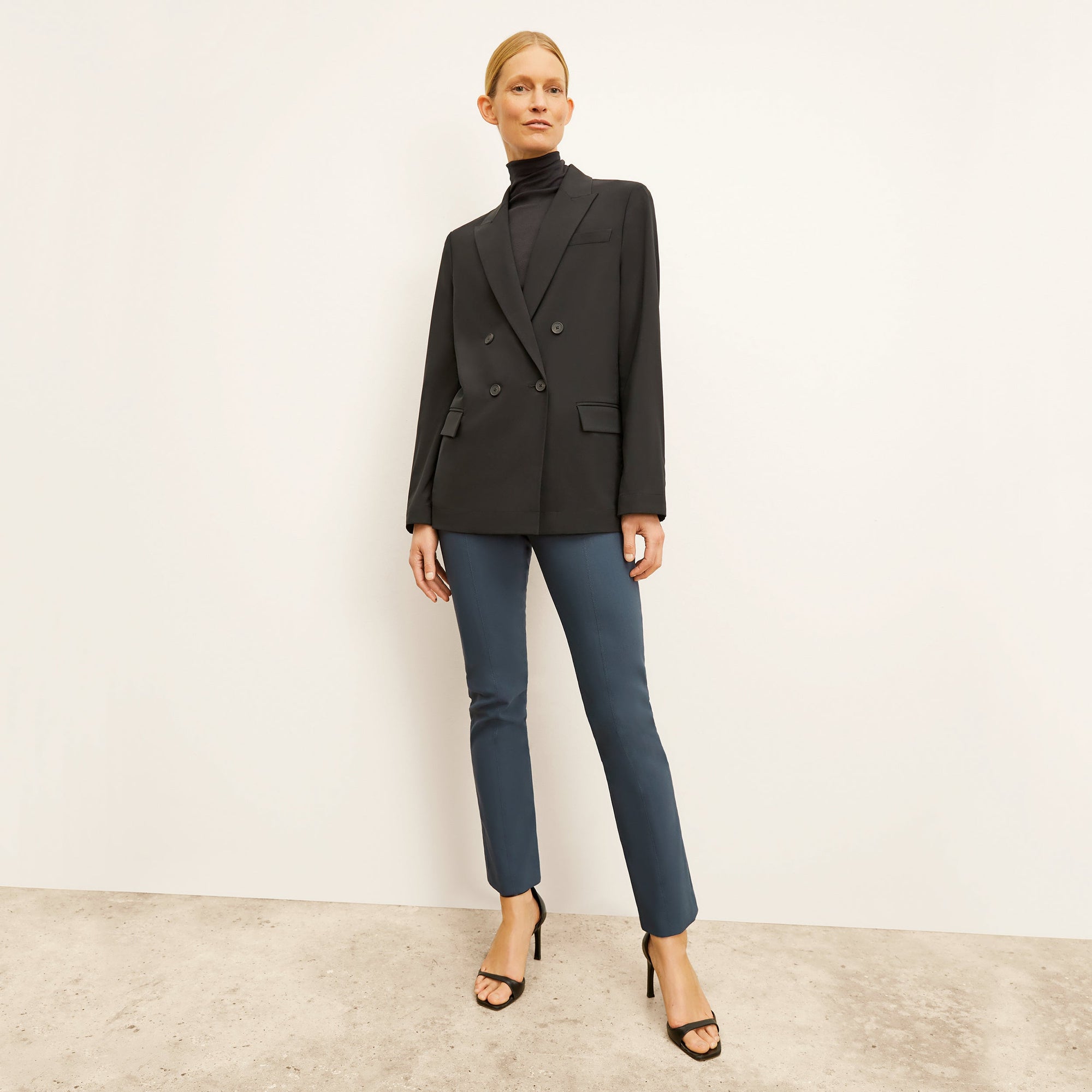 front image of a woman wearing the foster pant in lakeside