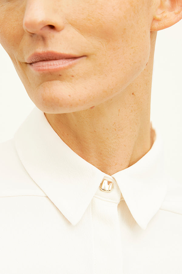 Front image of a woman standing wearing the Lagarde Shirt—Soft Wave in Alabaster | Exclude
