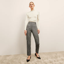 front image of a woman wearing the brodie top in ivory