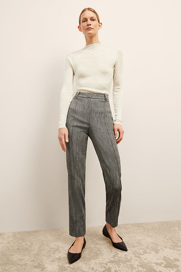 front image of a woman wearing the brodie top in ivory | Exclude