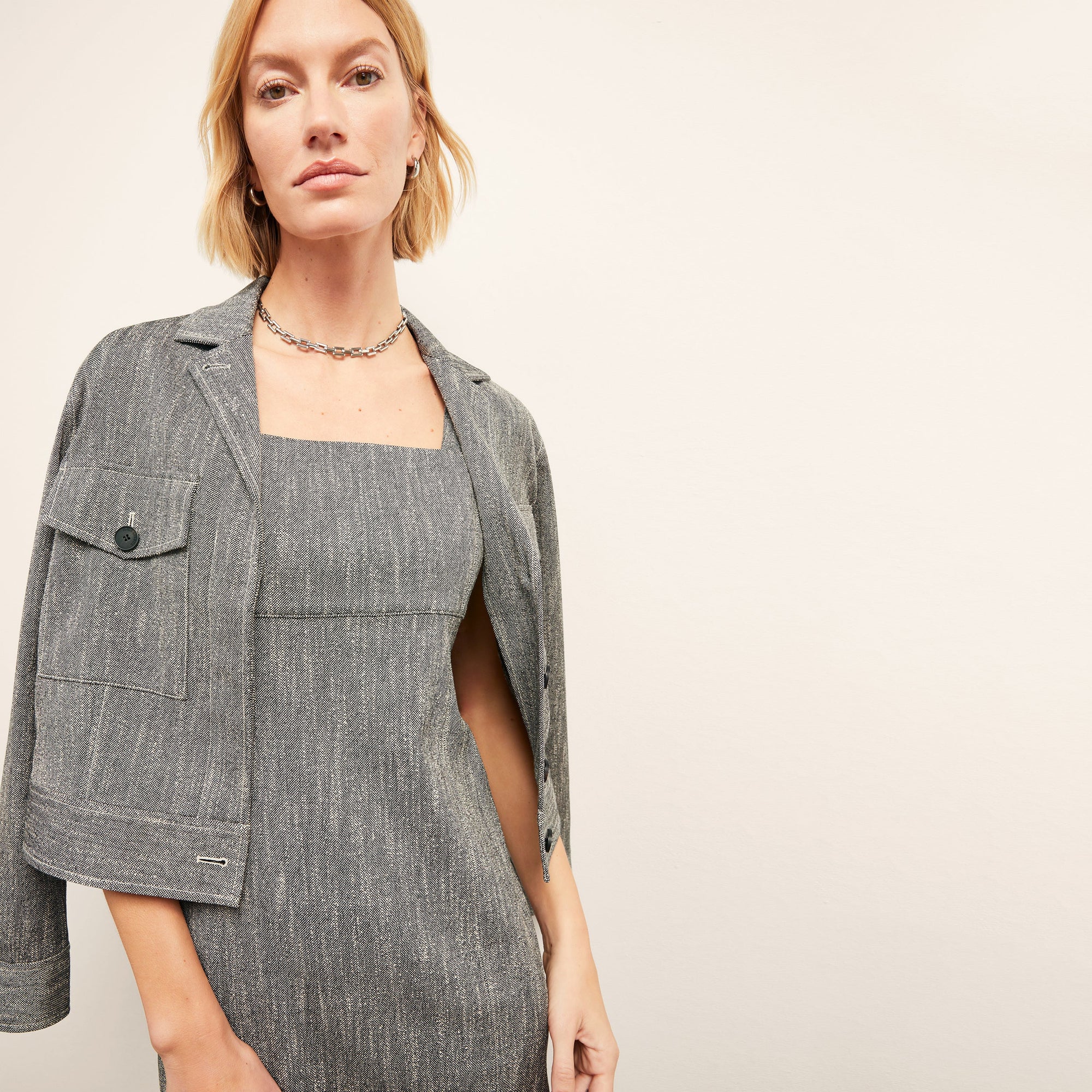 front image of a woman wearing the jennifer dress in black/ivory