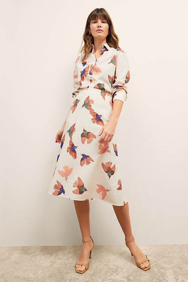 front image of a woman wearing the orchard skirt in hummingbird print | Exclude | Grid