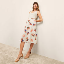 front image of a woman wearing the orchard skirt in hummingbird print
