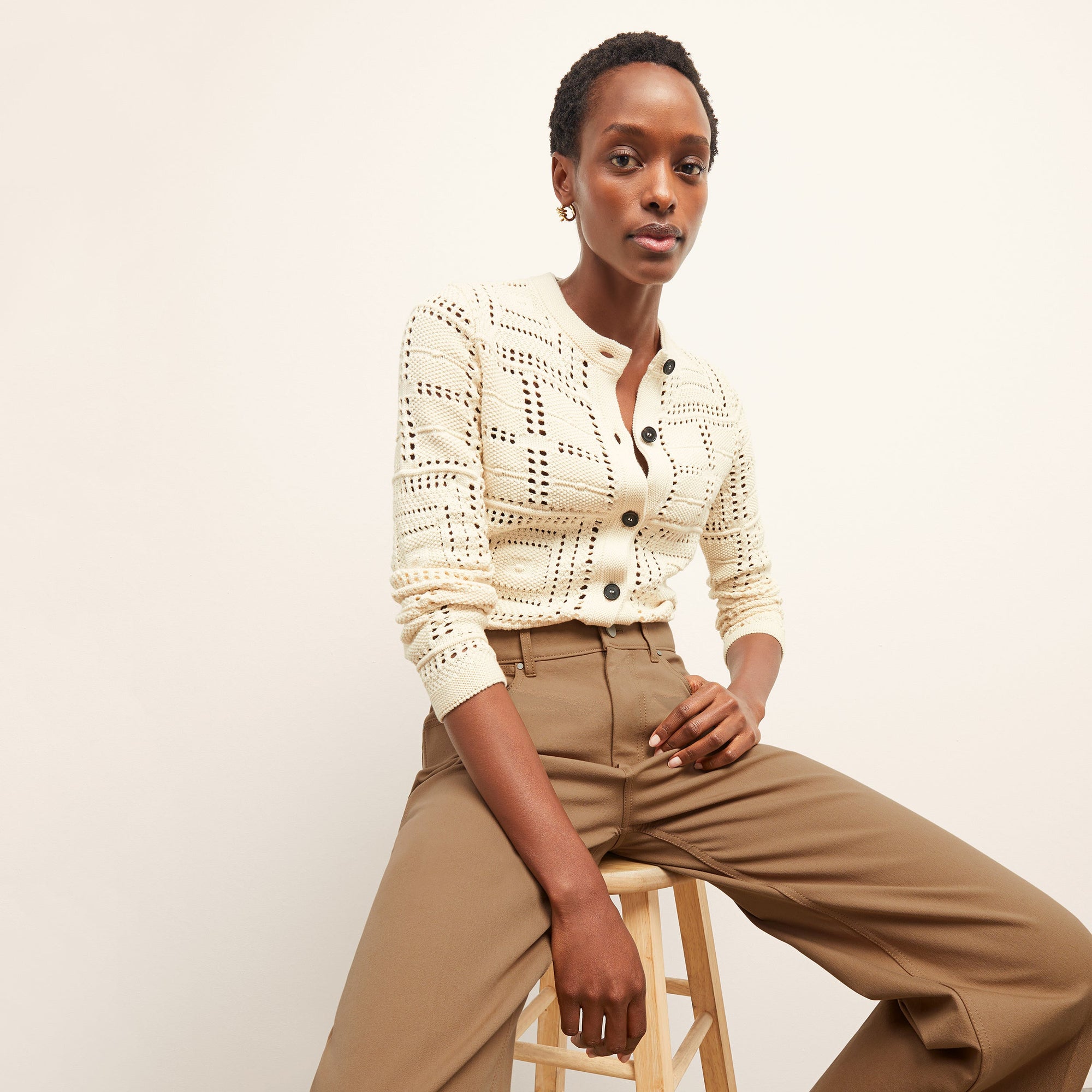 front image of a woman wearing the milo jean in saddle | Exclude
