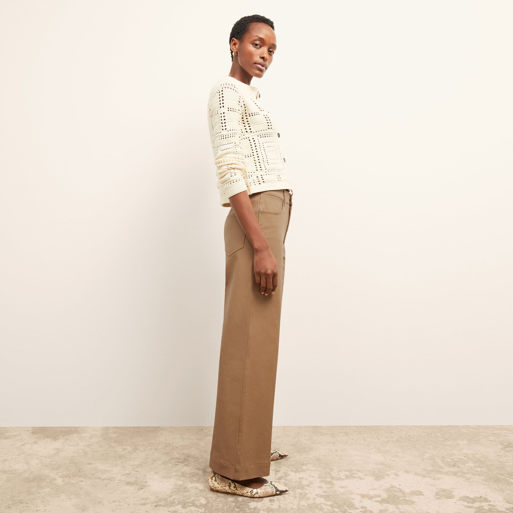 side image of a woman wearing the milo jean in saddle | Exclude