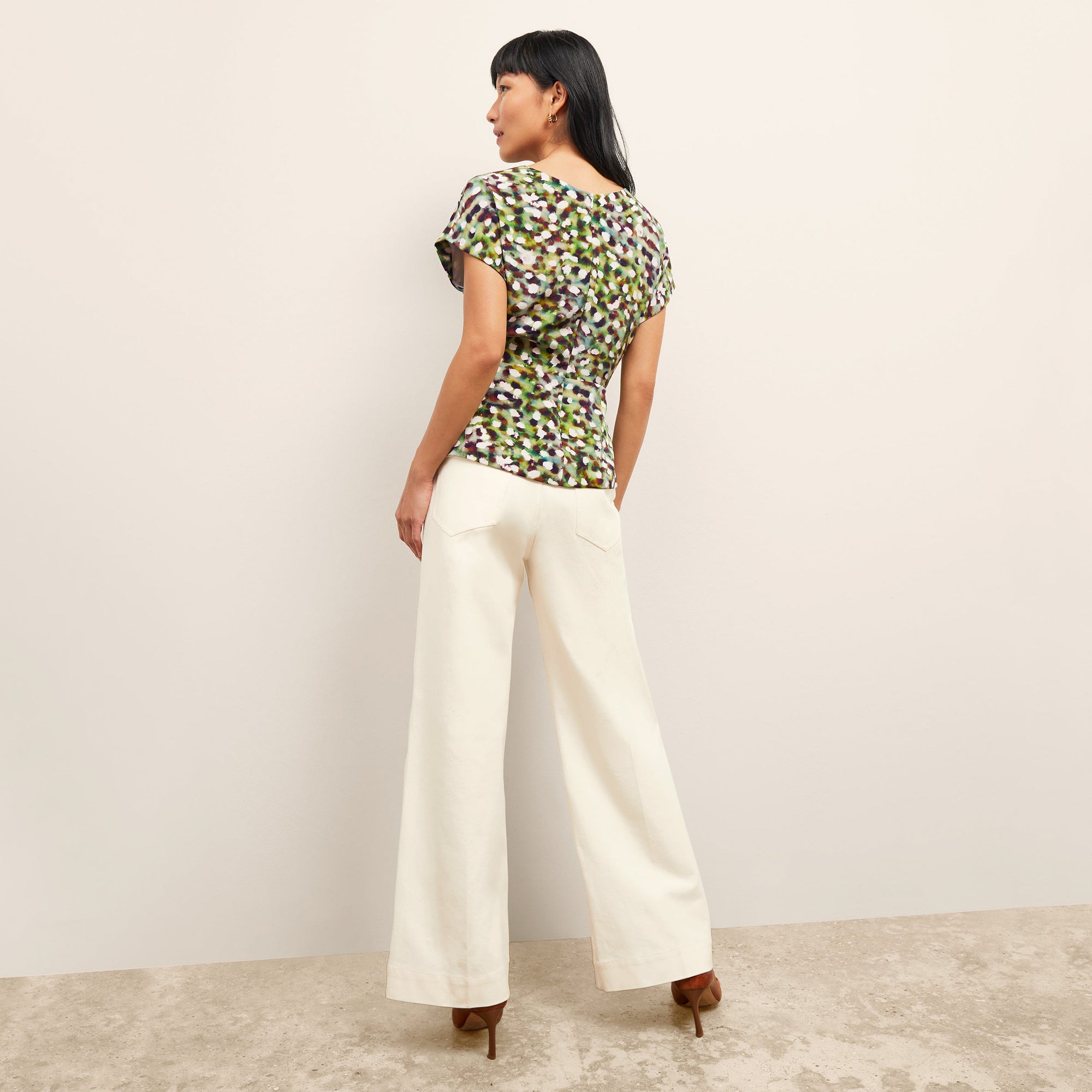 back image of a woman wearing the Milo Jean in Tusk | Exclude
