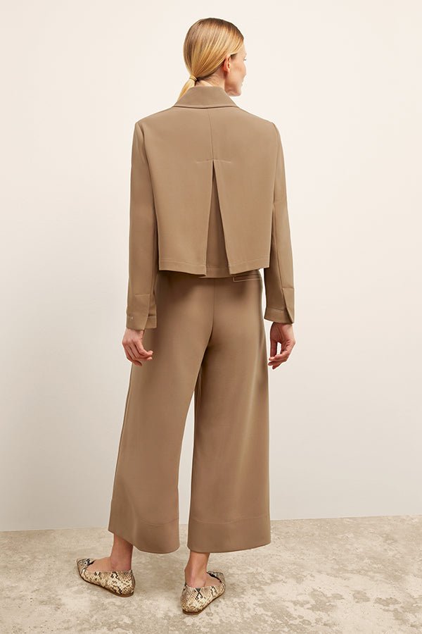 front image of a woman wearing the nicky jacket in saddle | Exclude