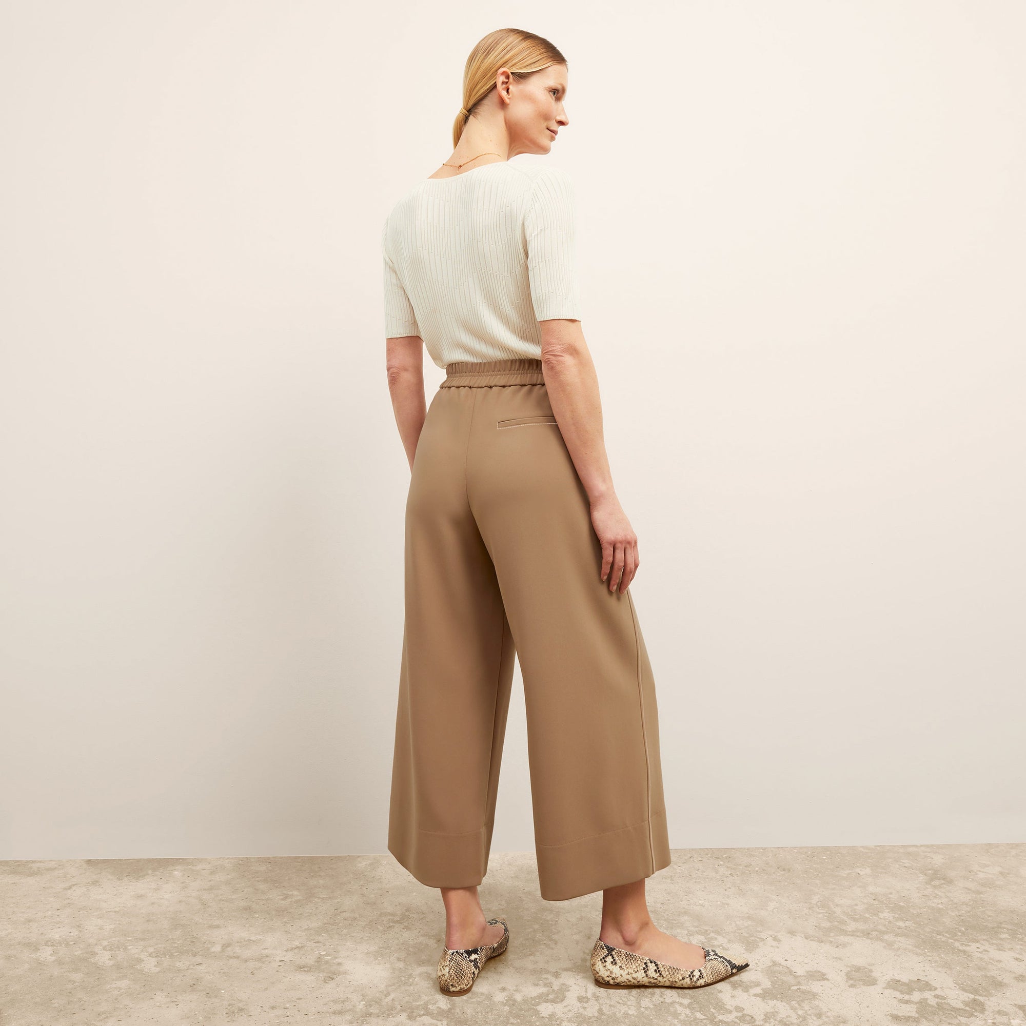 back image of a woman wearing the charlie top in ivory