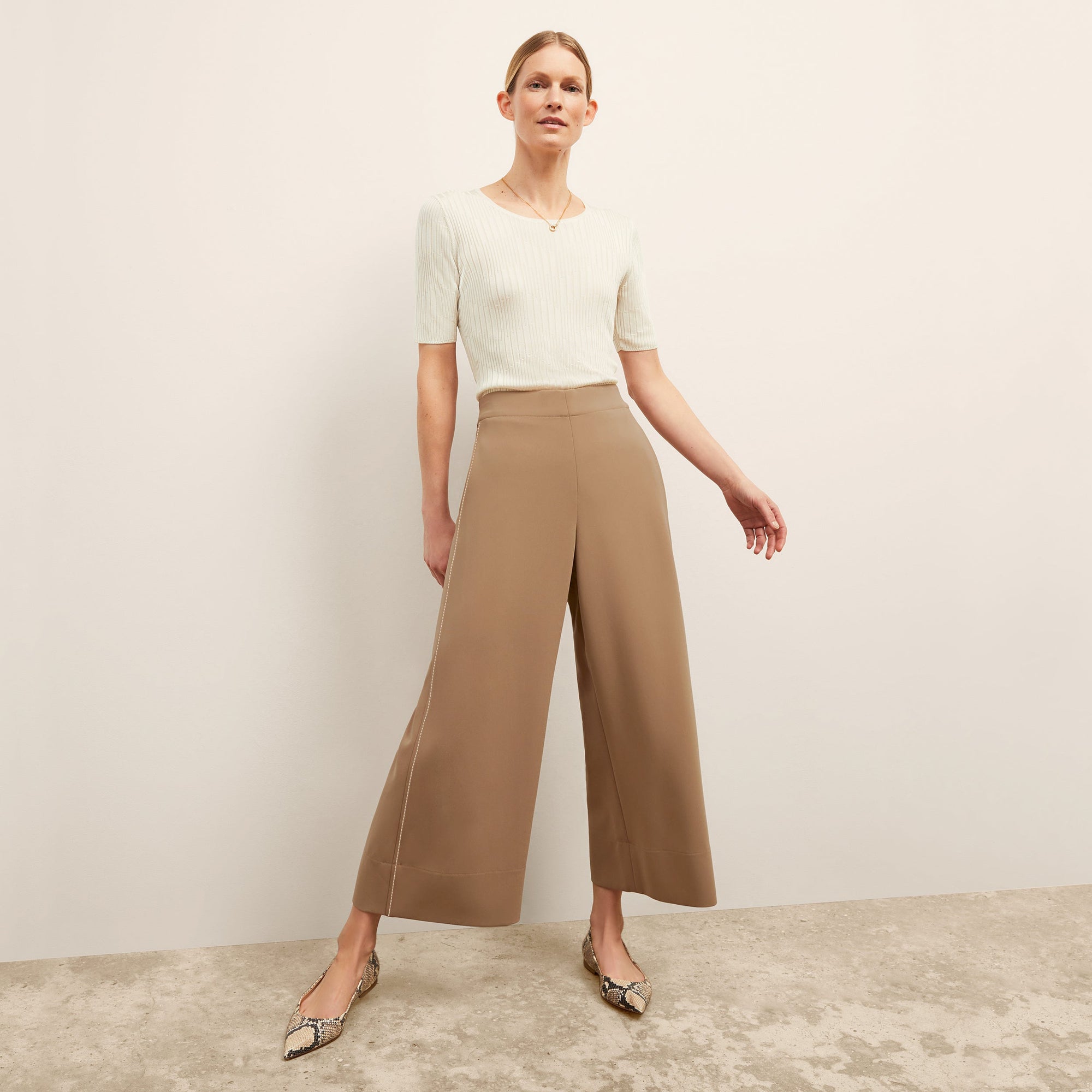 front image of a woman wearing the charlie top in ivory 