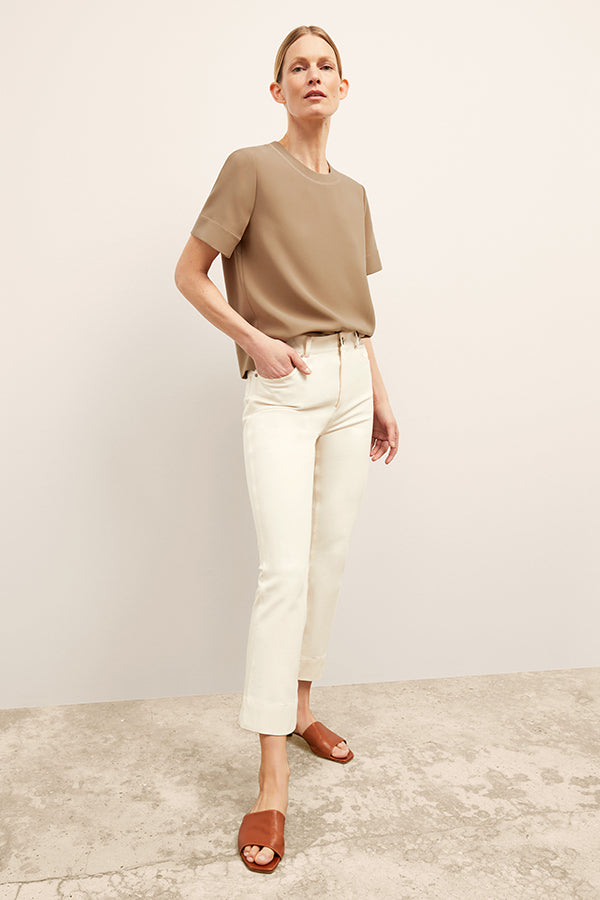 Front image of a woman wearing the Archie Jean in Tusk | Exclude