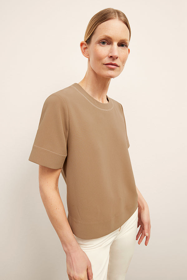 front image of a woman wearing the annika top in saddle | Exclude