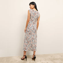 back image of a woman wearing the priya dress in leopard sketch