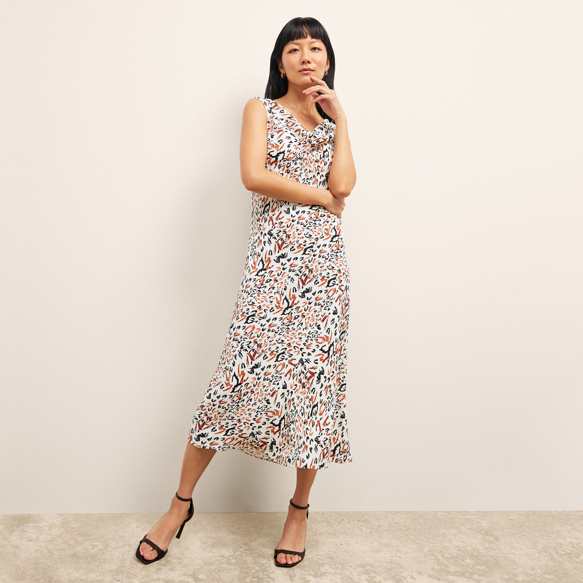 front image of a woman wearing the priya dress in leopard sketch | Lead