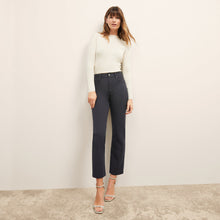 front image of a woman wearing the brodie top in ivory