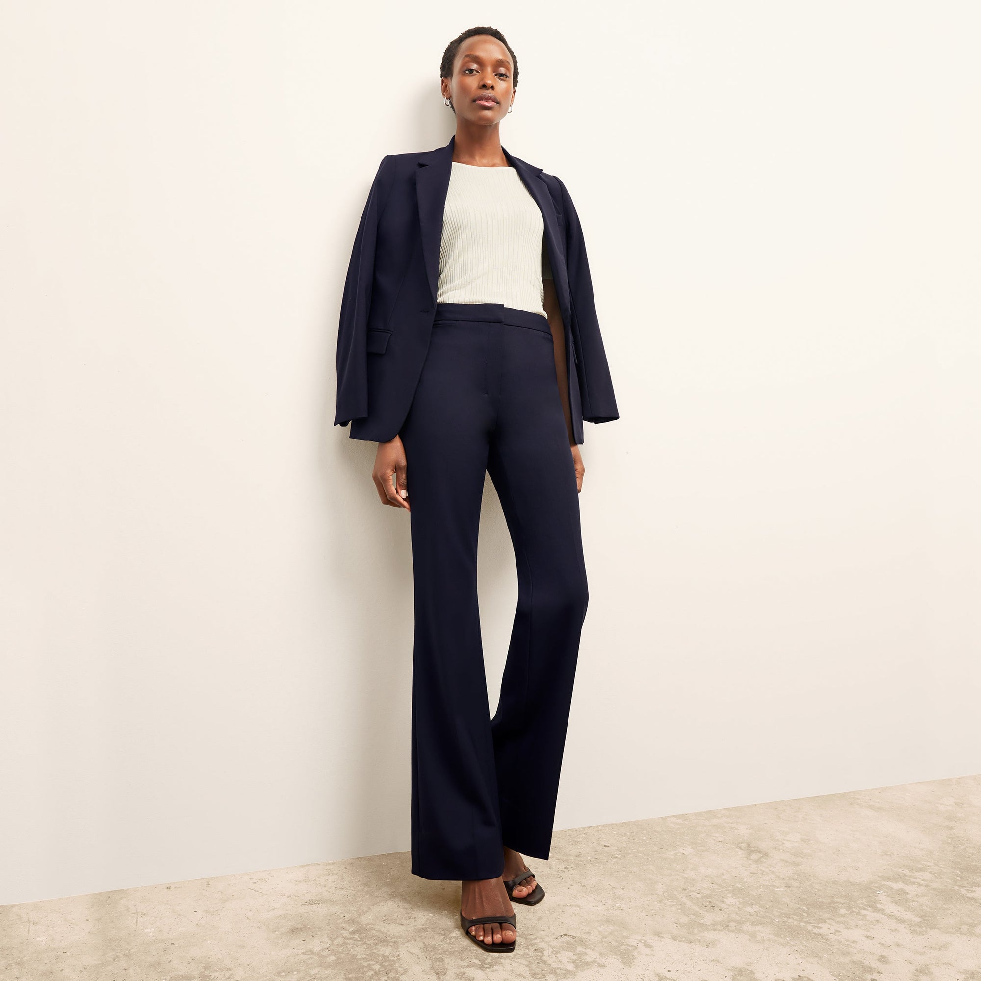 front image of a woman wearing the charlie top in ivory
