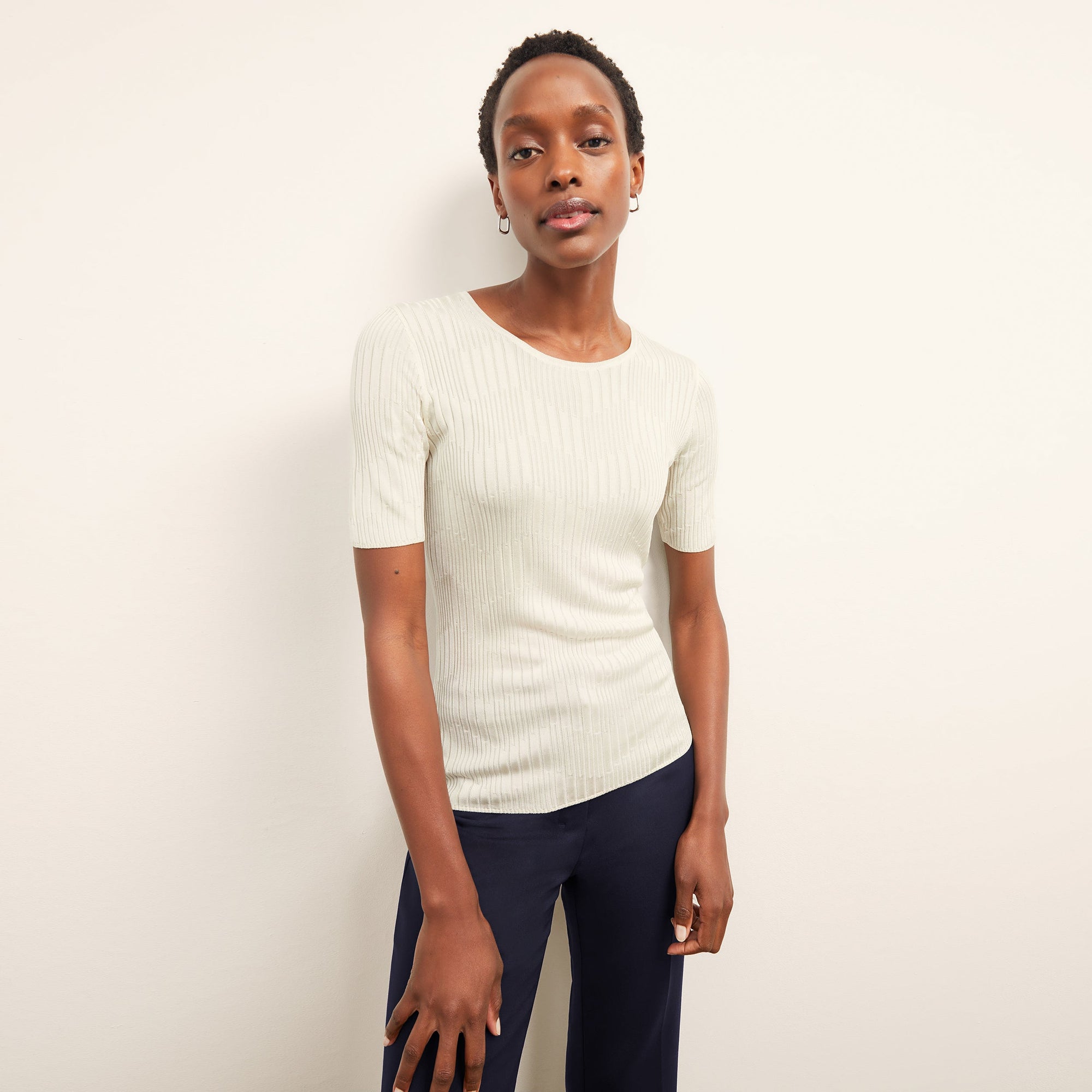 front image of a woman wearing the charlie top in ivory | Lead