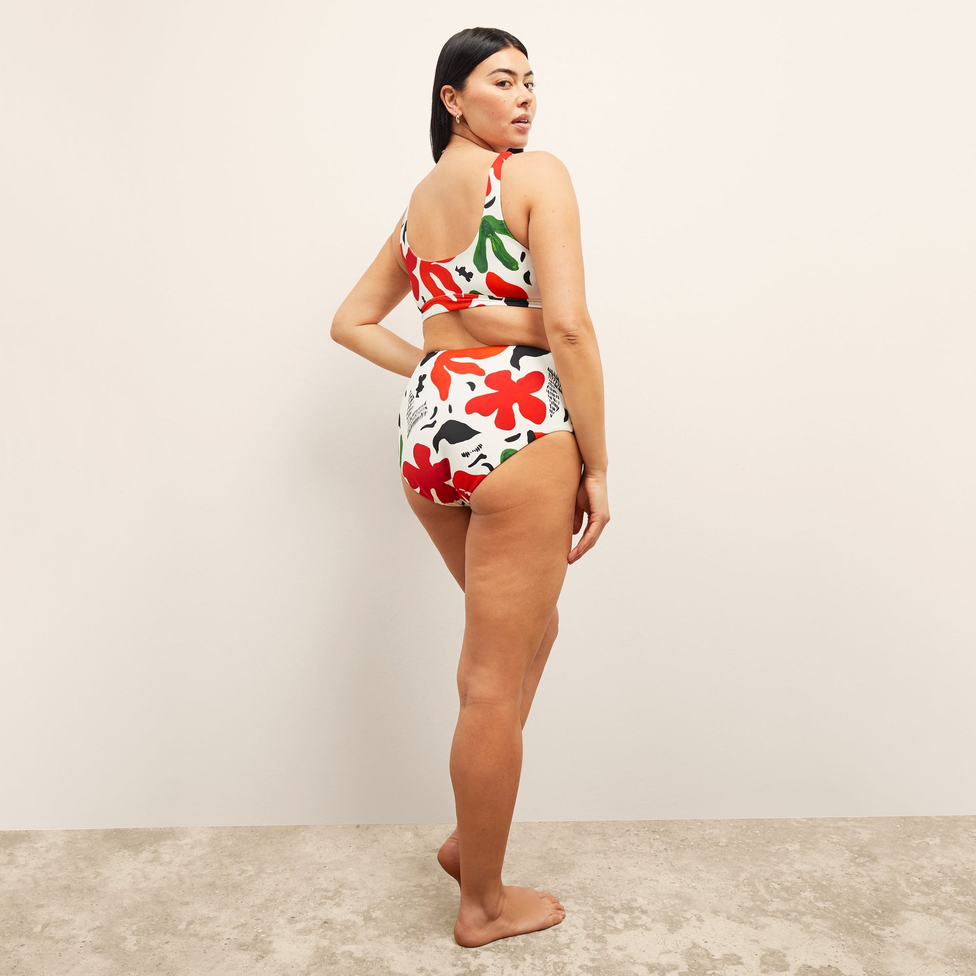 image of a woman wearing the M.M.LaFleurxAndie Portofina Bikini Bottom in cutout floral