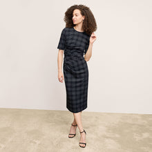 front image of a woman wearing the ciela dress in black/white | Lead