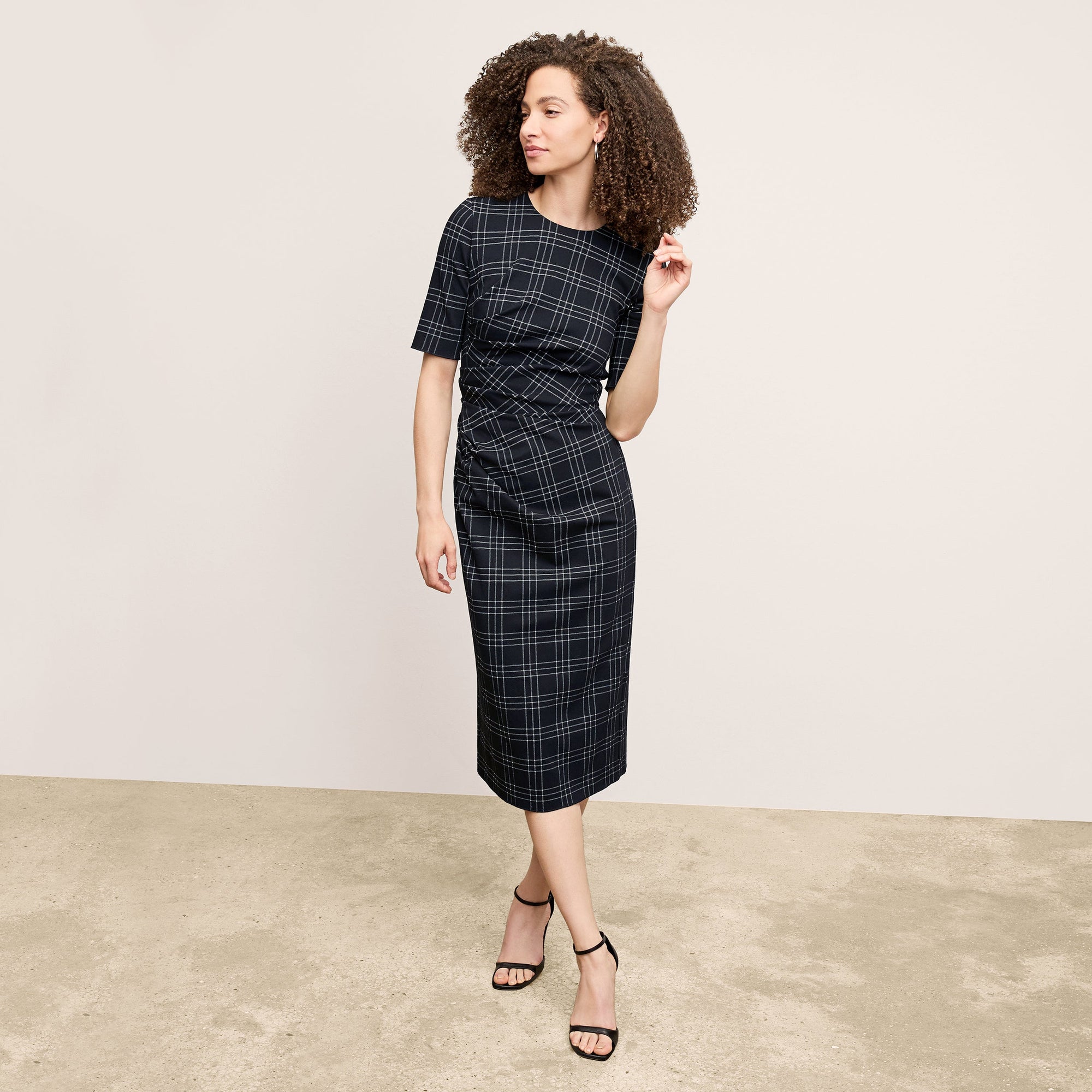front image of a woman wearing the ciela dress in black/white | Lead