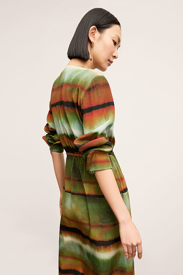 Back image of a woman wearing the Deana dress in Faded Print | Exclude