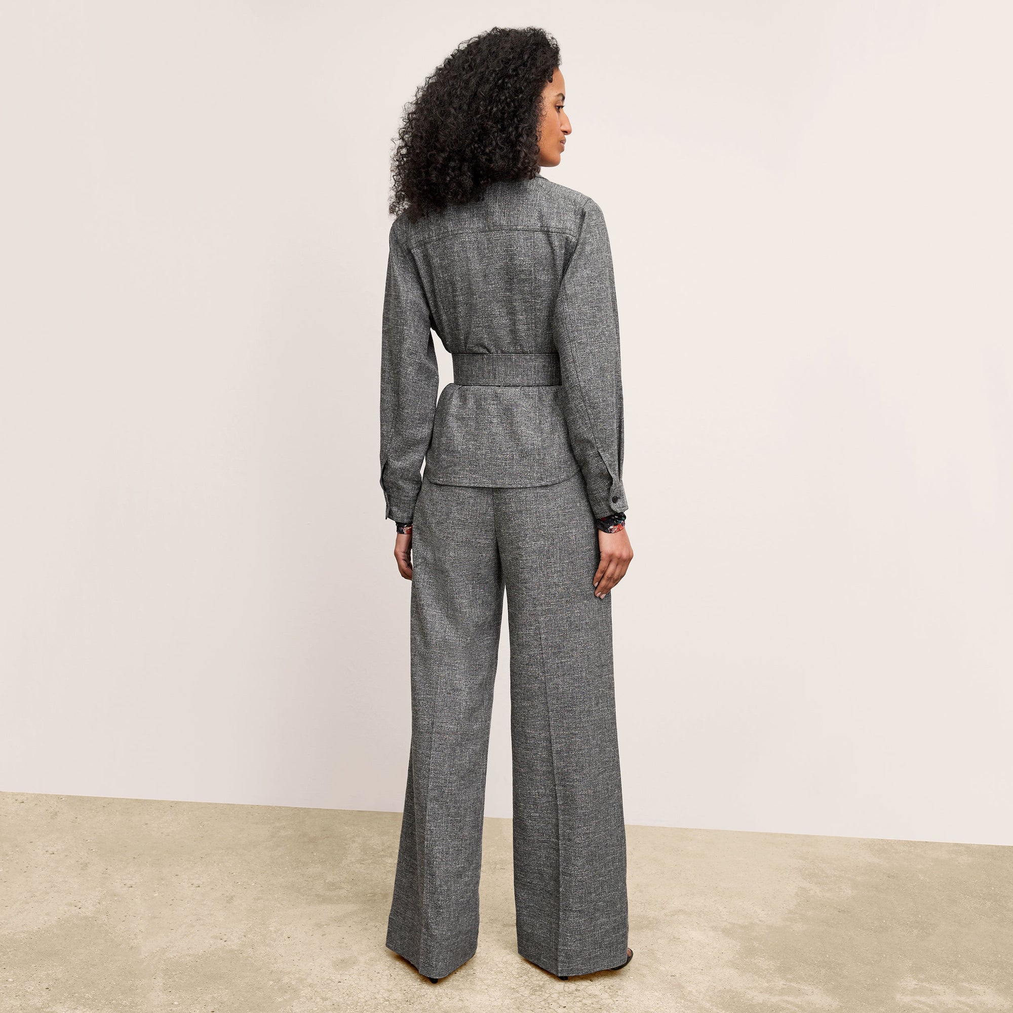back image of a woman wearing the natalia jacket in black/white