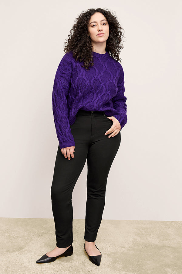 front image of a woman wearing the roma jean in black | Exclude