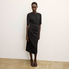 front image of a woman wearing the ciela dress in black  | Lead