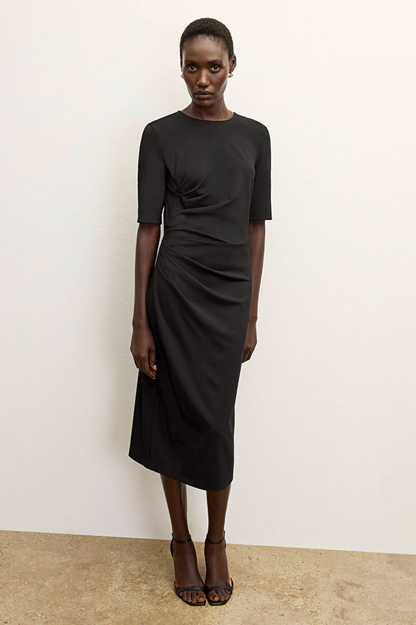 front image of a woman wearing the ciela dress in black | Exclude