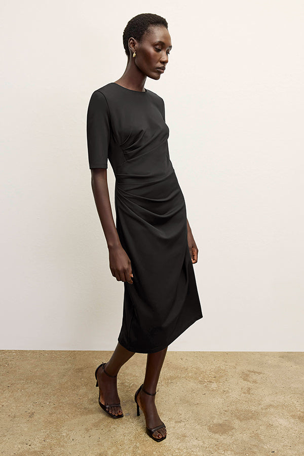 front image of a woman wearing the ciela dress in black | Exclude