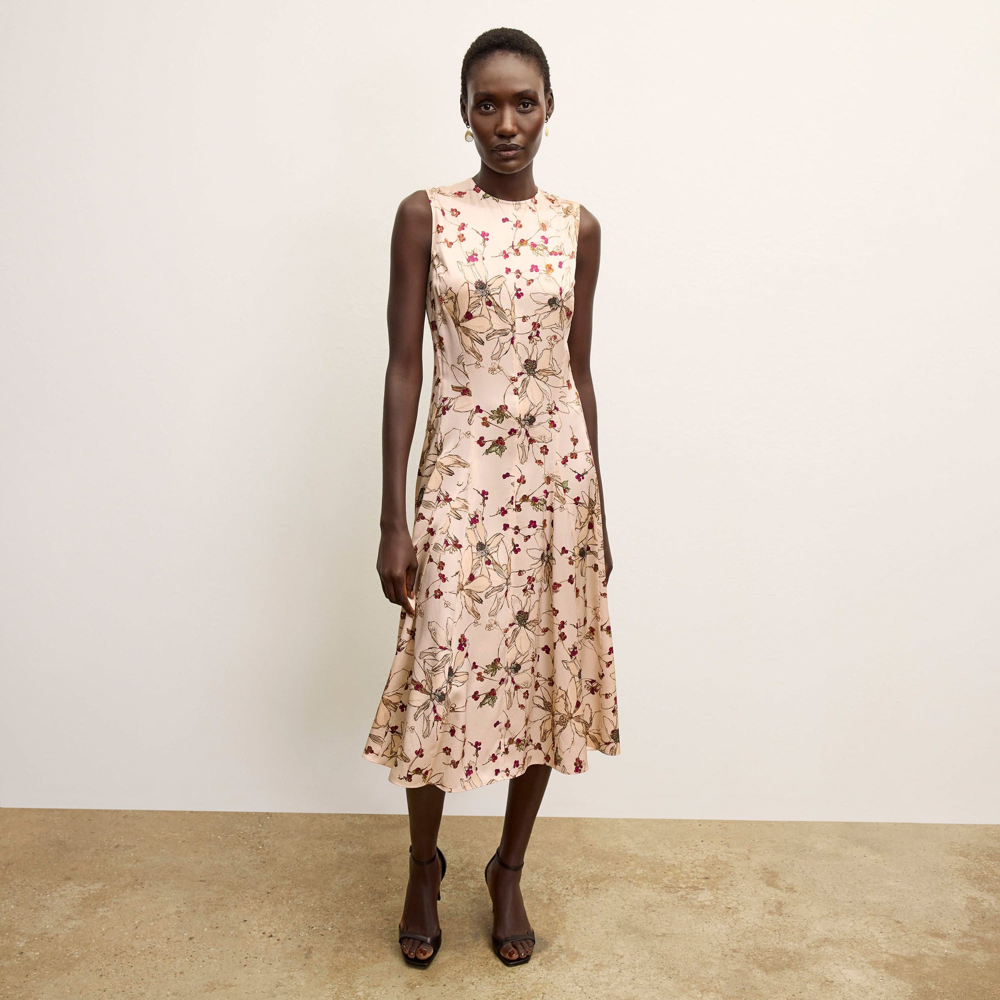 front image of a woman wearing the nyla dress in botanical print | Lead