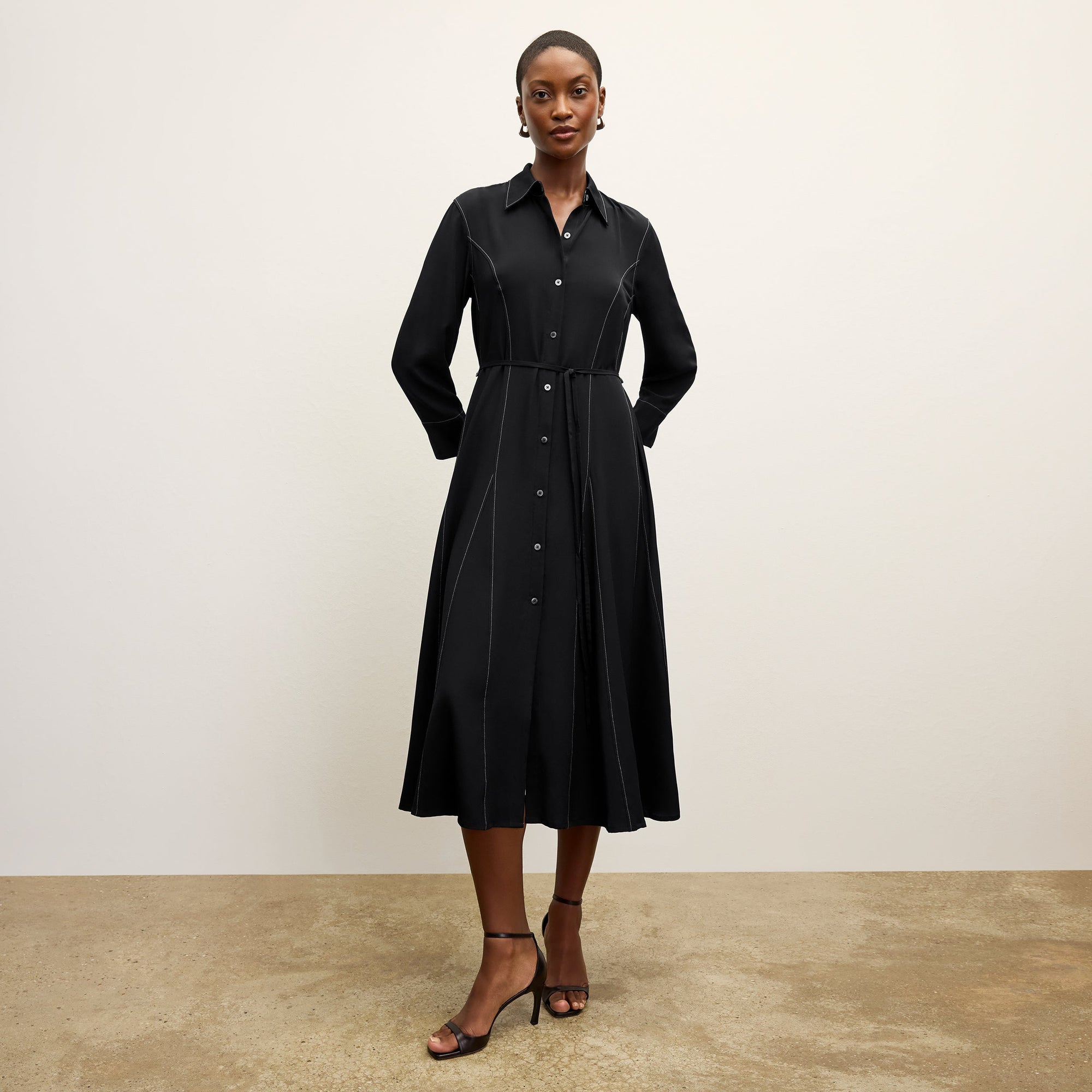 front image of a woman wearing the pepper dress in black | Lead