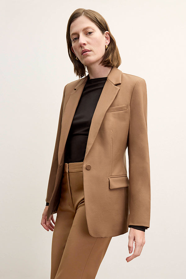 Front image of a woman standing wearing the Yiyan Blazer in Camel | Exclude | Grid