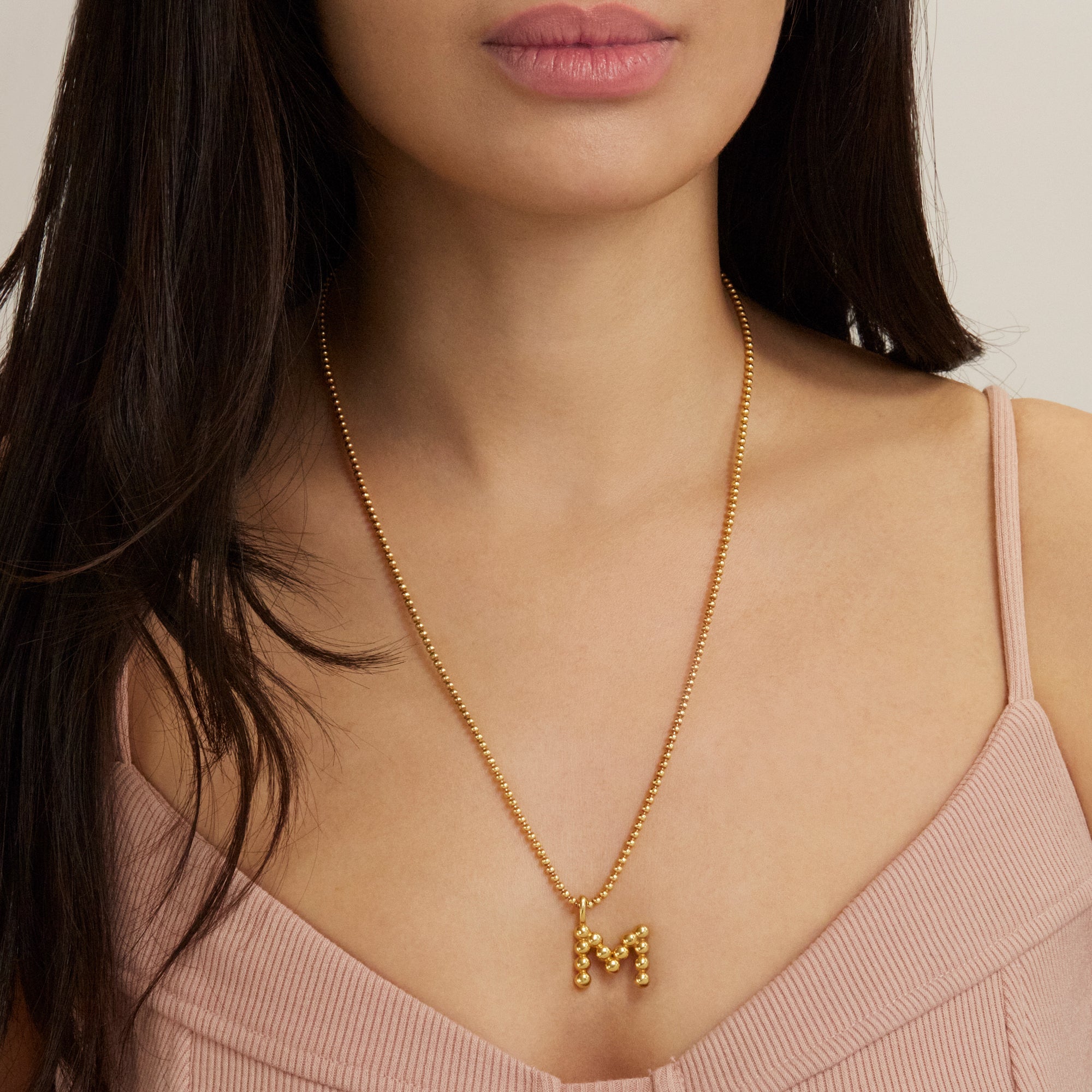 Image of Gold Vermeil Mochi Donut Initial Necklace on Models Neck