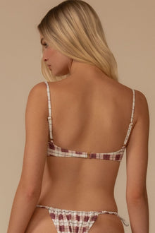 Maroon and white plaid bikini top with thin shoulder straps and ruched petal-style fabric detail at the bust.