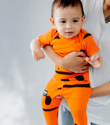 Unisex | Smirks Onesie | Orange Sun