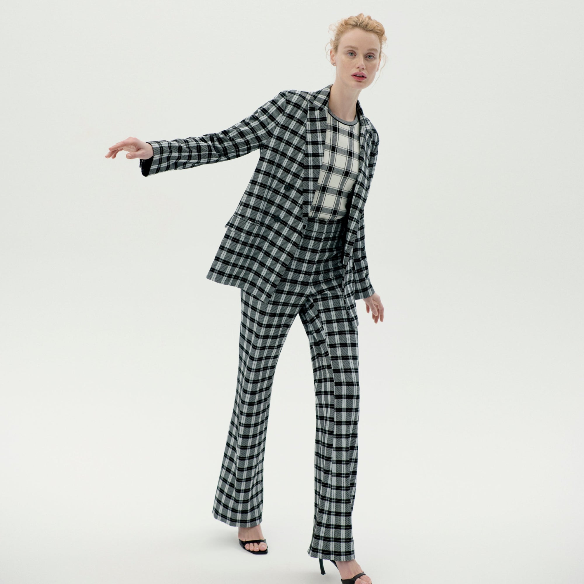 Front image of a woman wearing the horton pants in checkmate