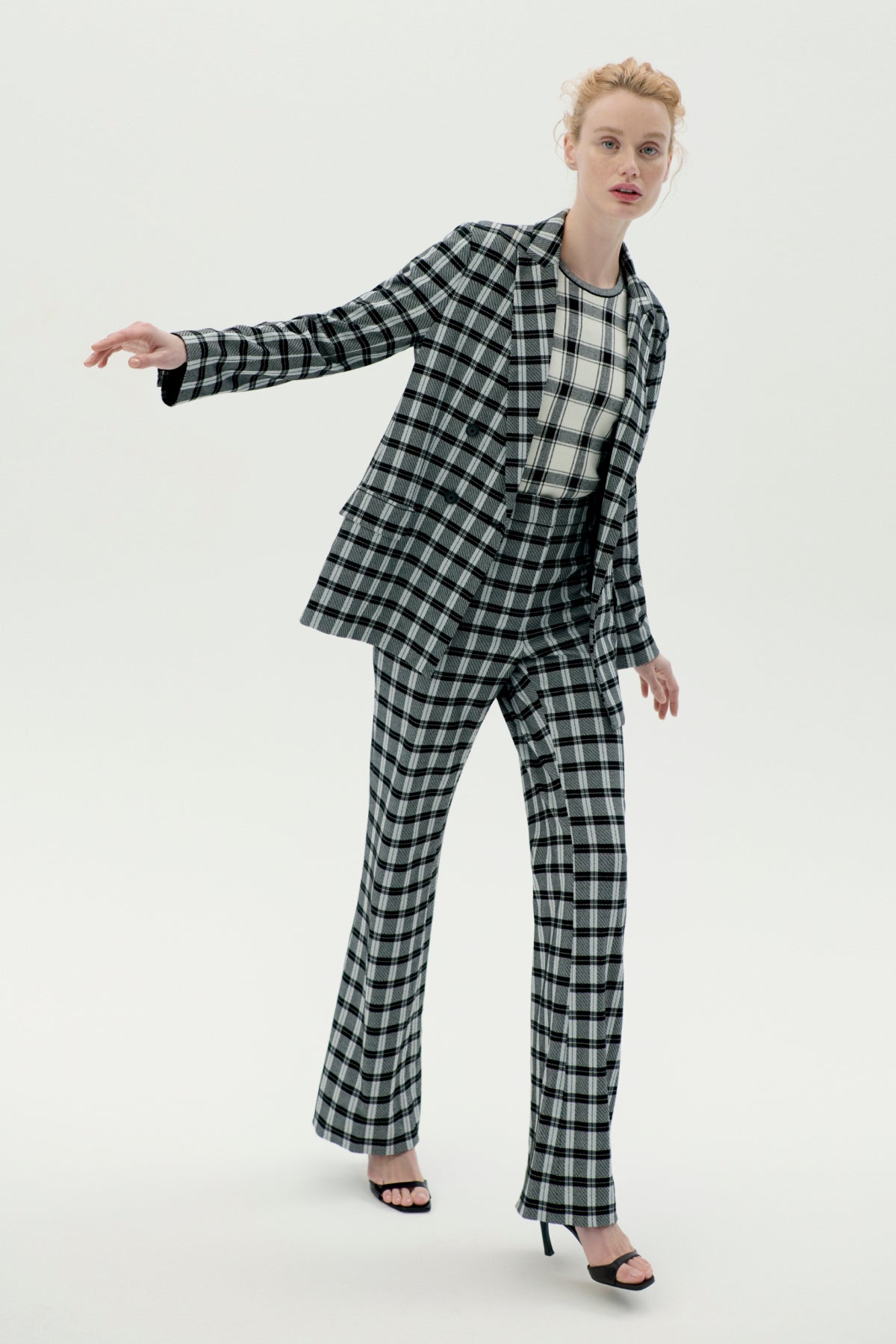 Front image of a woman wearing the horton pants in checkmate | Exclude | ALT GRID