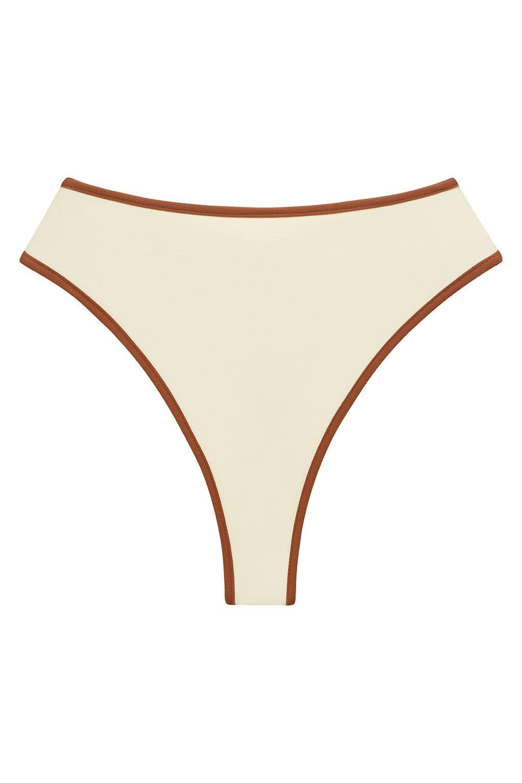 Oat-colored bikini bottom with terracotta binding trim along the waistband and leg openings.