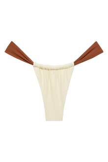 Oat and terracotta bikini bottom with ruched waistband and contrasting terracotta tie sides.