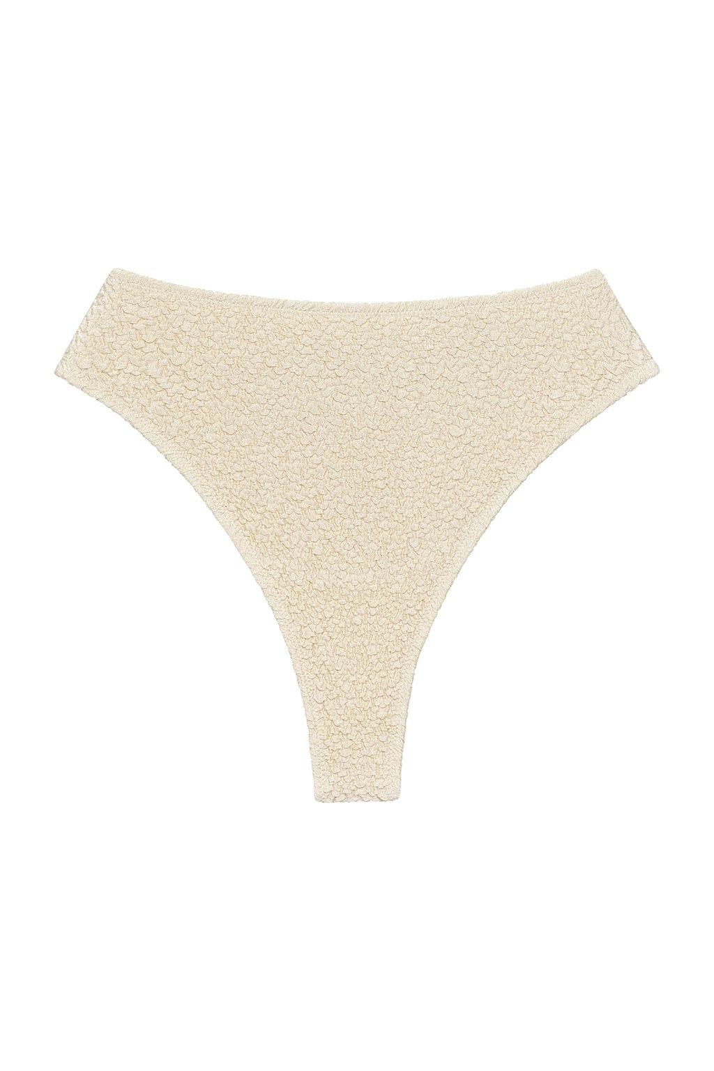 Oat-colored bikini bottom with textured fabric and high-cut thong design.