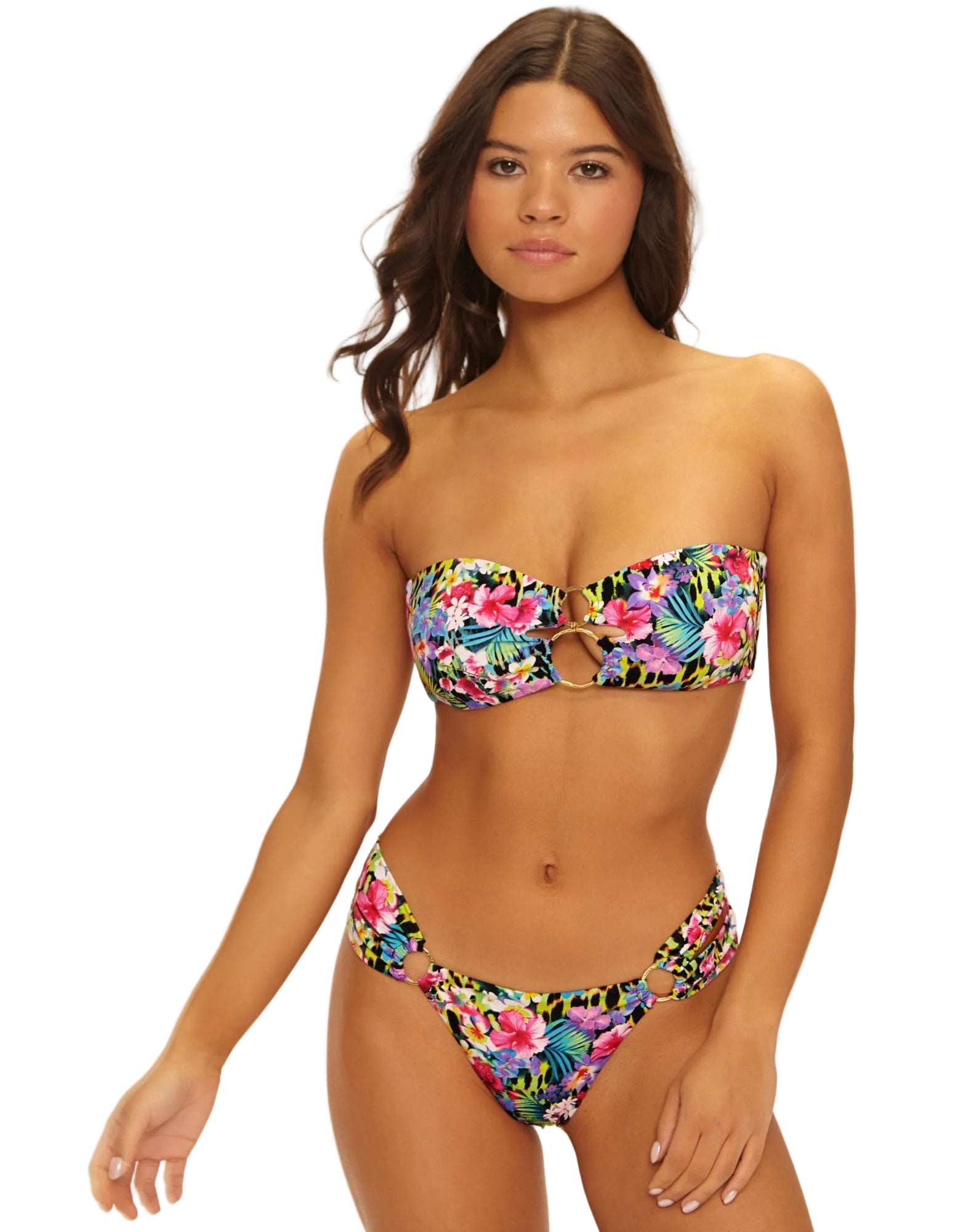 Woman wearing a colorful floral bikini on a white background