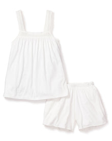 The Petite Plume Womens Pima Camille Short Set in White includes a sleeveless top with lace-trimmed straps and matching shorts, both crafted from luxurious Peruvian Pima cotton for comfort. Featuring an elastic waistband, the ensemble offers a loose, flowy fit on a crisp white background.
