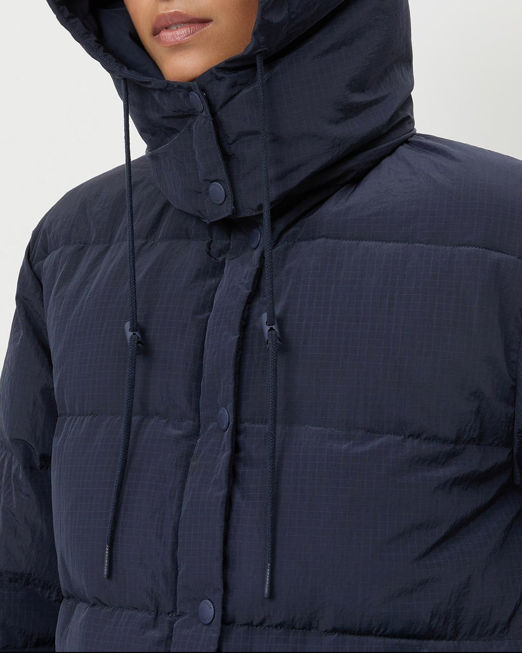 Pippa Puffer Coat in navy nylon and brown wool.