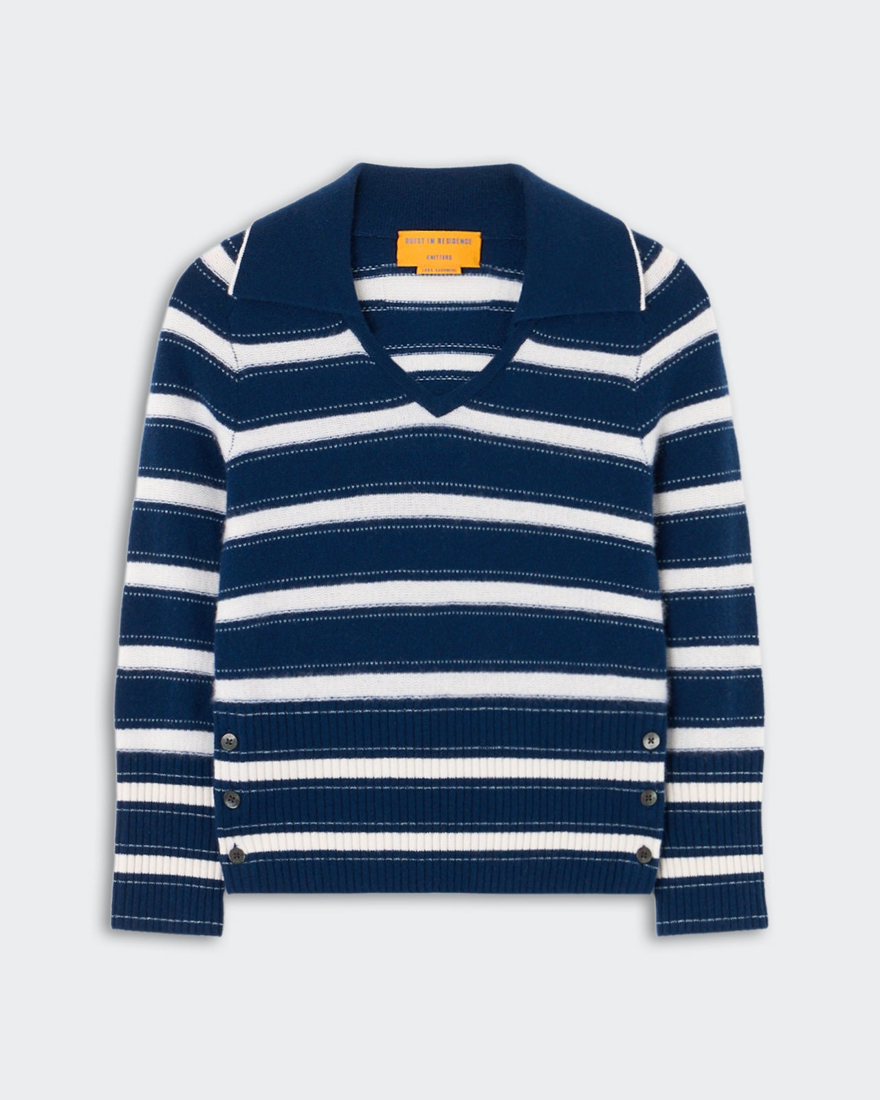 Port Polo - Navy Combo, a long-sleeve knit sweater with navy and white horizontal stripes, featuring a wide collar, V-neckline, and button details along the ribbed hem, laid flat.