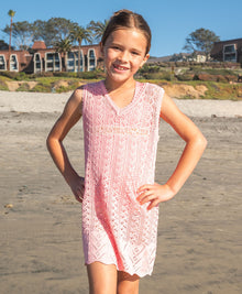 Kids Pink Sands Kaia Knit Dress — soft pink crochet cover-up with playful knit details and relaxed V-neckline.