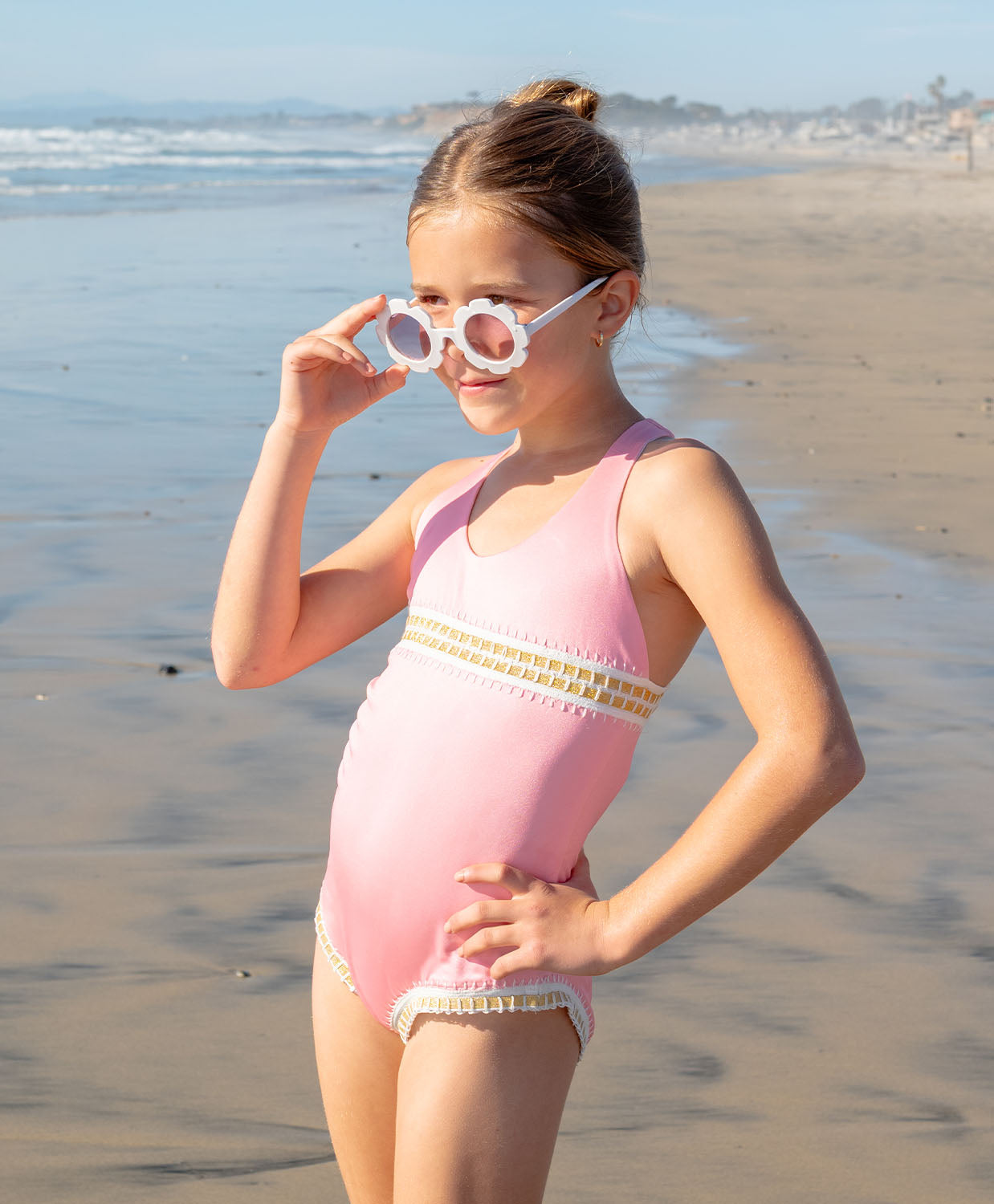 Kids Pink Sands Mabel Rainbow Embroidered One Piece — soft pink swimsuit with gold embroidery inspired by Solange Ferrarini's colorful designs.